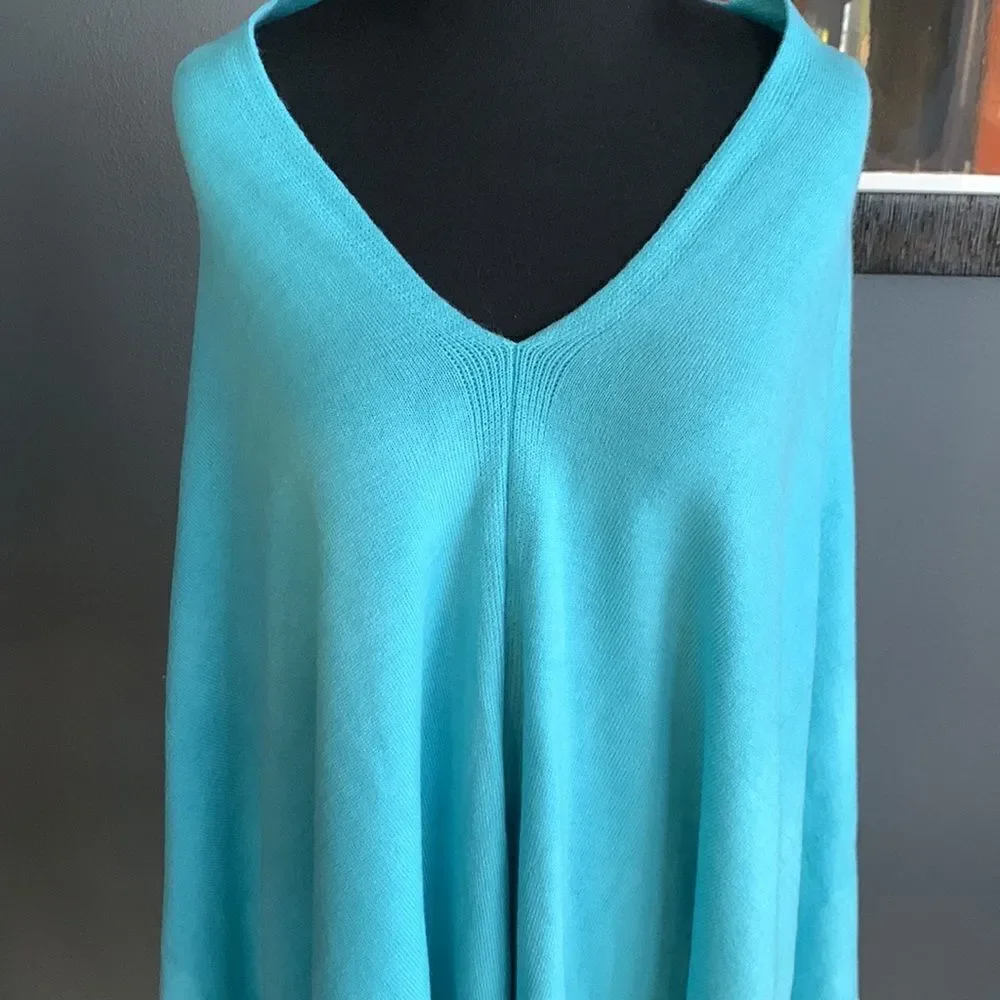 Soft turquoise V neck sweater cape. Asymmetrical front hem. NWT. one size.